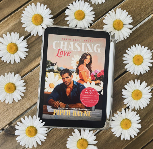 An Ipad mini showing the cover photo of the book CHasing Love by Piper Rayne